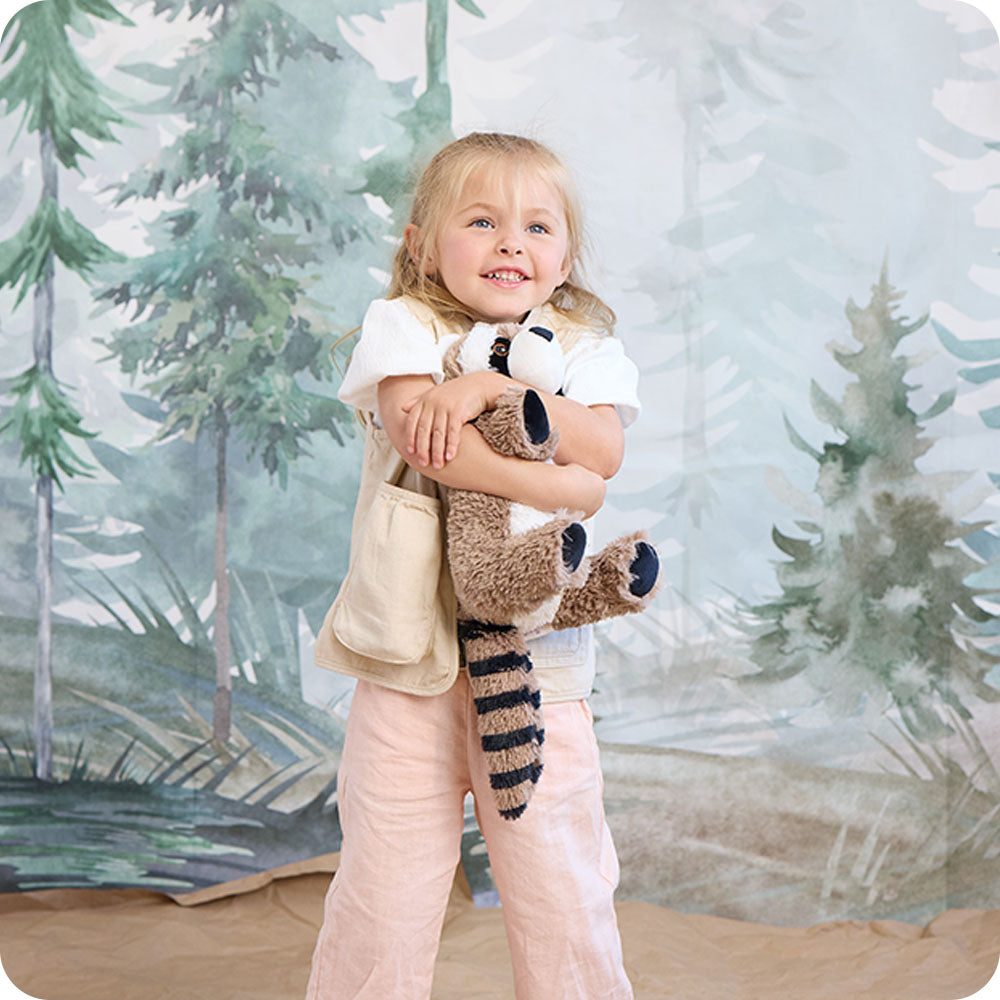 Image 106: girl hugging raccoon stuffed animal