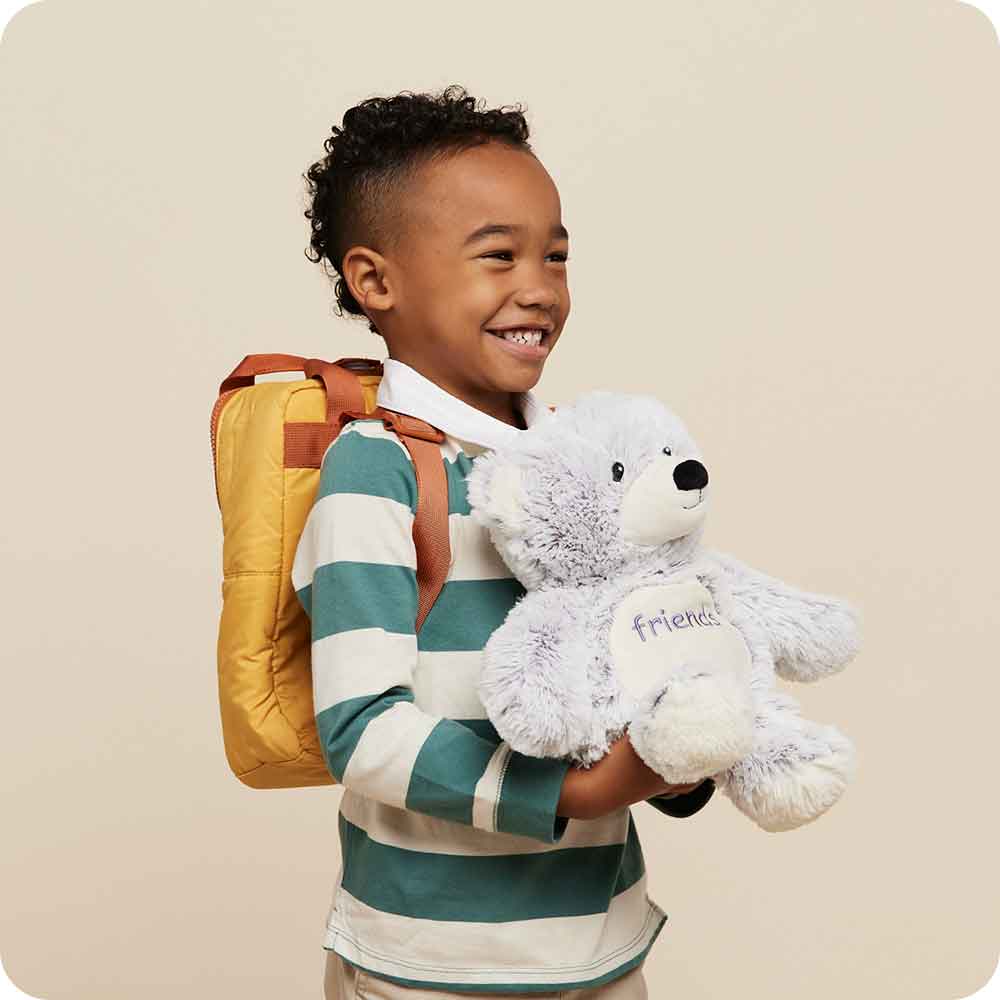 Image 99: Little boy holding Cute Weighted Lavender Scented Friends Bear Stuffed Animal Heating Pad Warmies