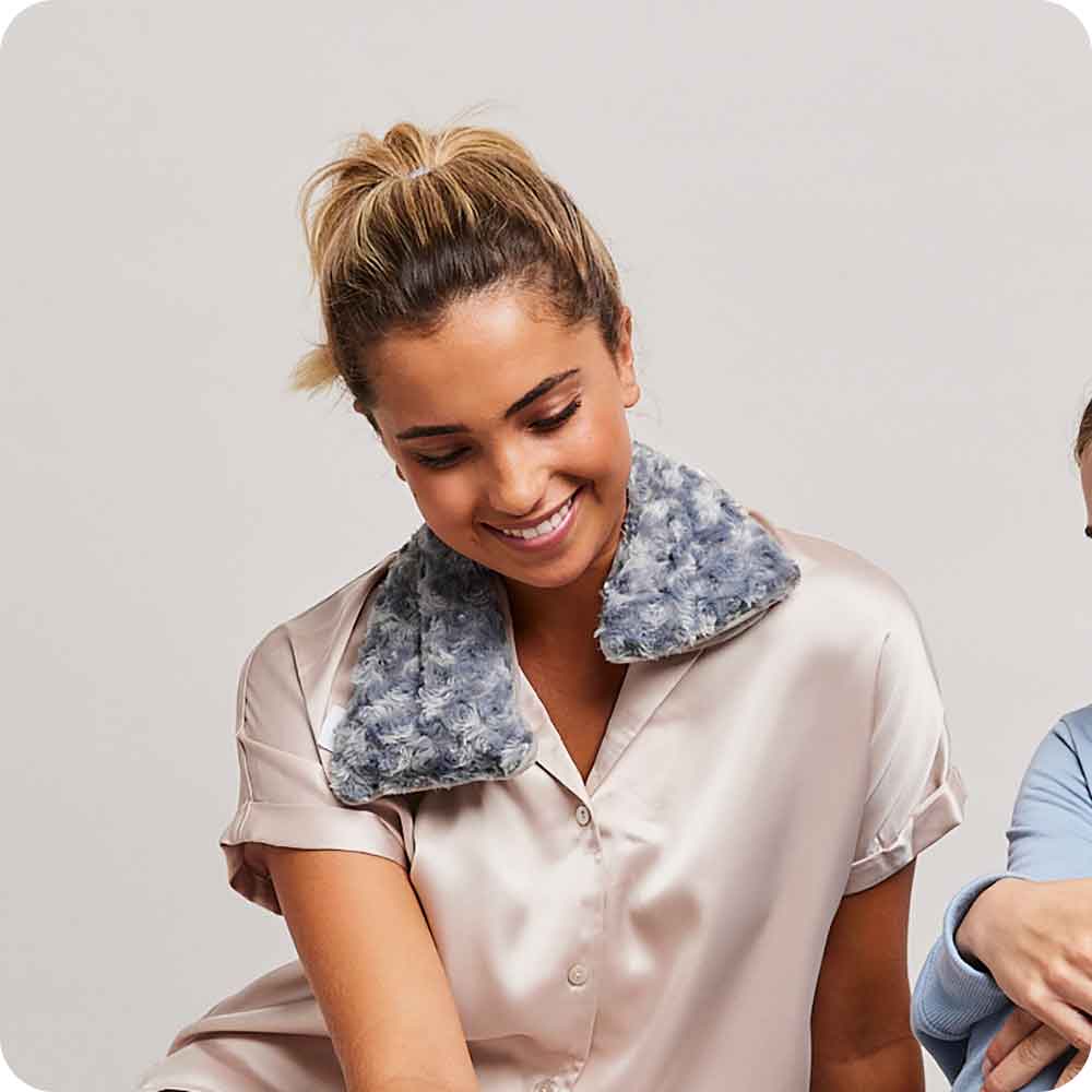 Image 90: Woman smiling with Microwavable Curly Gray Warmies Neck Wrap