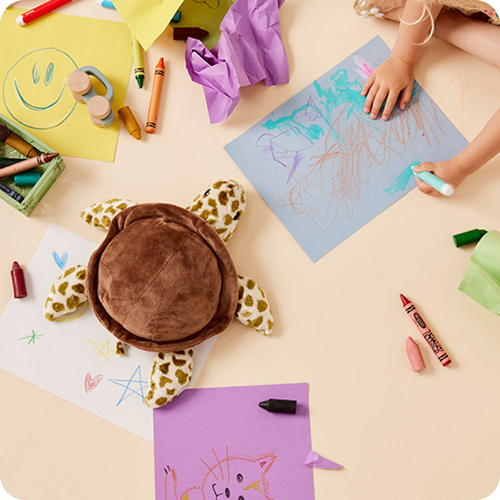 Image 107: sea turtle stuffed animal on kids coloring table