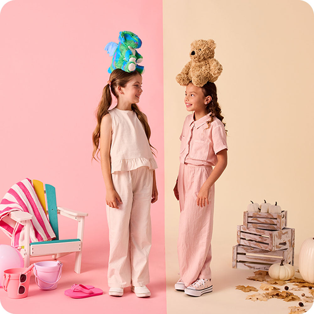 Image 105: girl with a baby dragon stuffed animal on her head