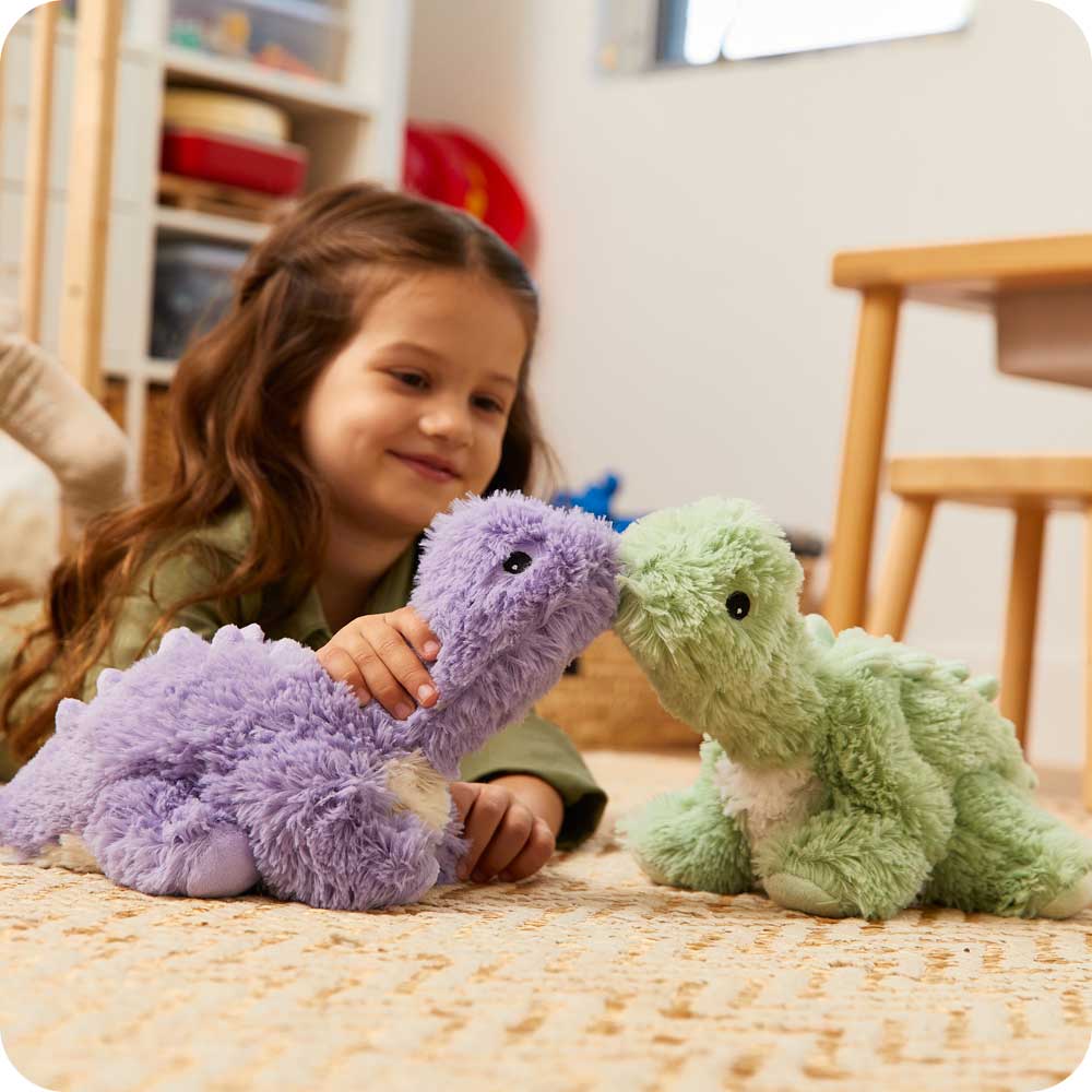 Image 99: Child playing with Soft Warm Weighted Green Long Neck Dinosaur Plush Warmies