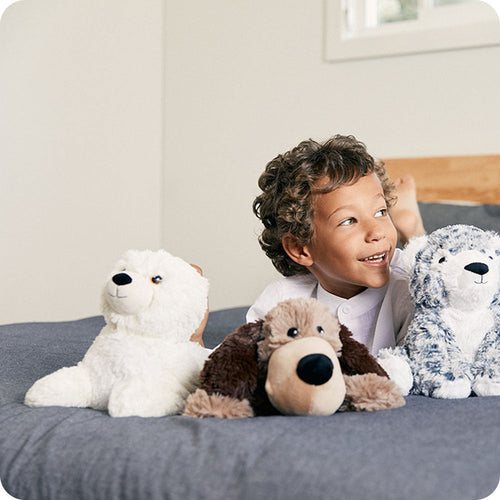 Image 98: baby seal stuffed animal on boys bed