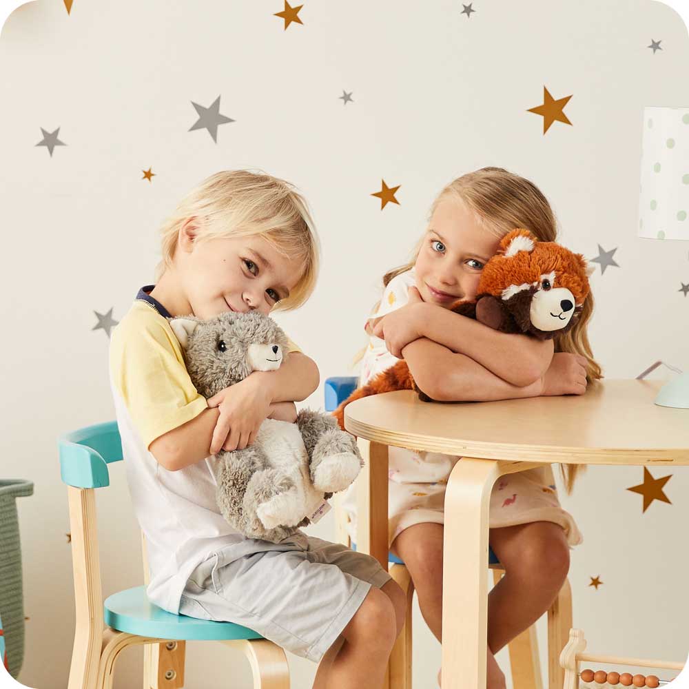 Image 101: Little boy and girl sitting and hugging Cute Weighted Lavender Scented Squirrel Stuffed Animal Heating Pad Warmies