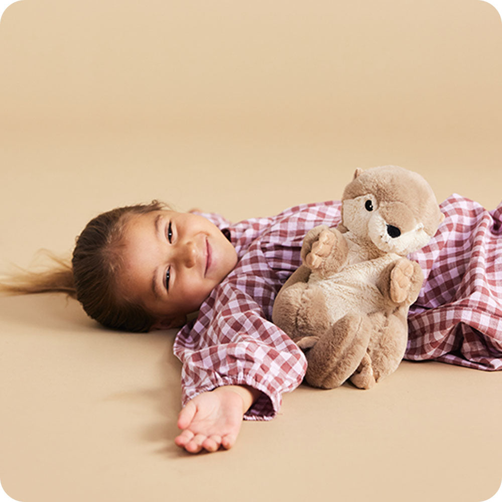 Image 102: girl with otter stuffed animal
