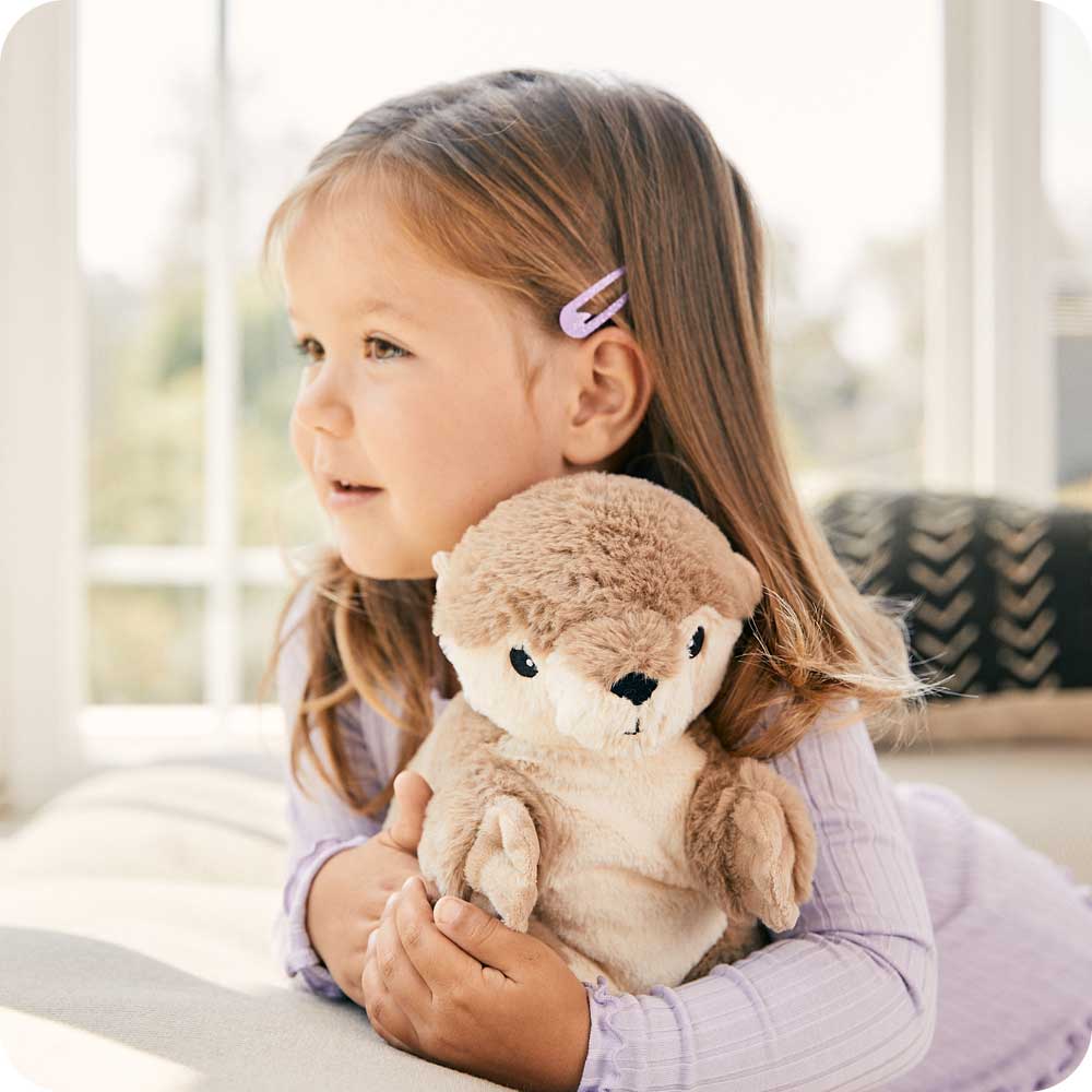 Image 103: Toddler hugging Cute Weighted Lavender Scented Otter Stuffed Animal Heating Pad Warmies
