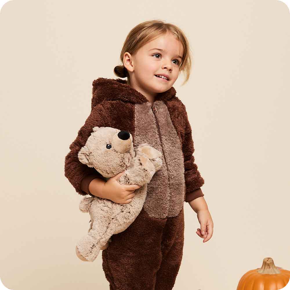 Image 101: Child holding a Soft Warm Weighted Brown Bear Warmies