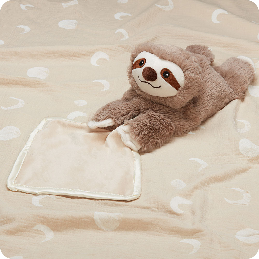 Image 93: sloth blankie warmies on a blanket