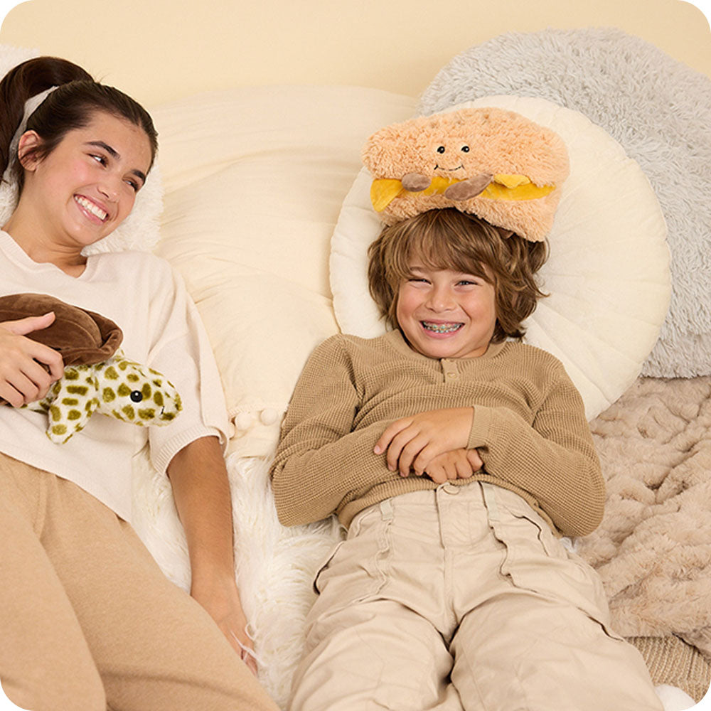Image 106: boy with a grilled cheese stuffed animal warmies on his head