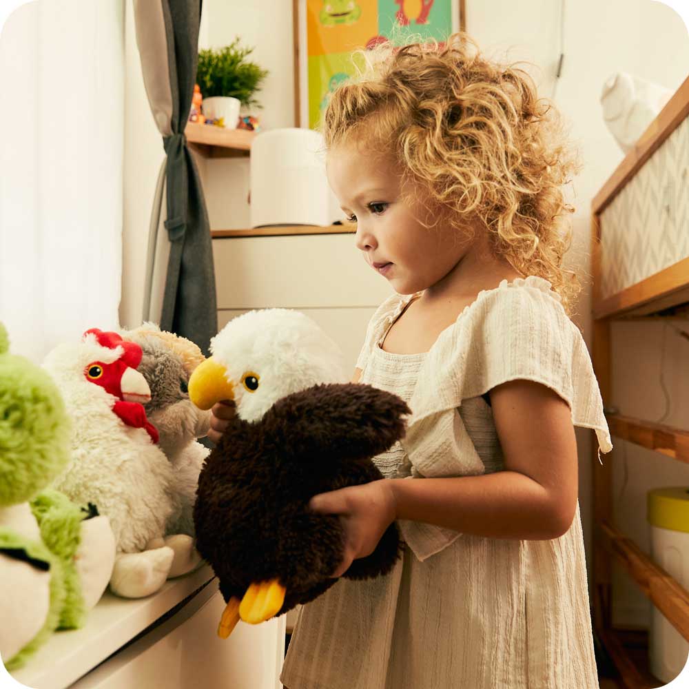 Image 102: Toddler playing with Cute Weighted Lavender Scented Eagle Stuffed Animal Heating Pad Warmies