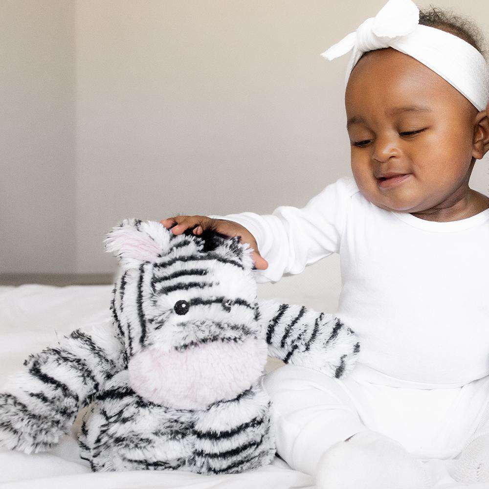 Image 102: Baby playing with Soft Warm Weighted Zebra Plush Warmies
