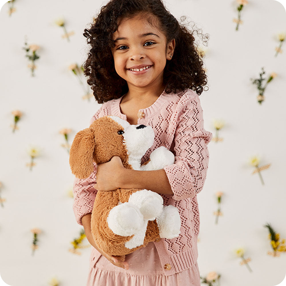 Image 103: girl holding beagle stuffed animal lifestyle