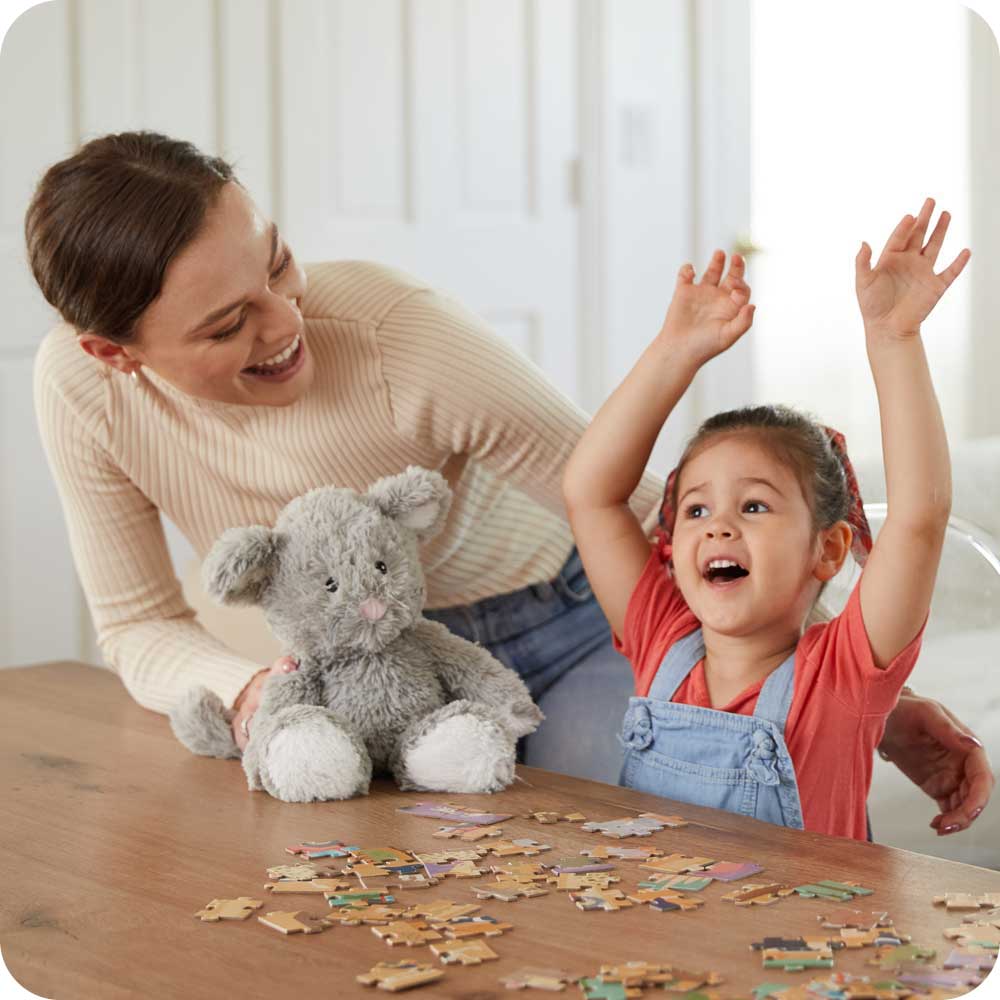 Image 100: Mother and daughter playing with Cute Weighted Lavender Scented Mouse Stuffed Animal Heating Pad Warmies