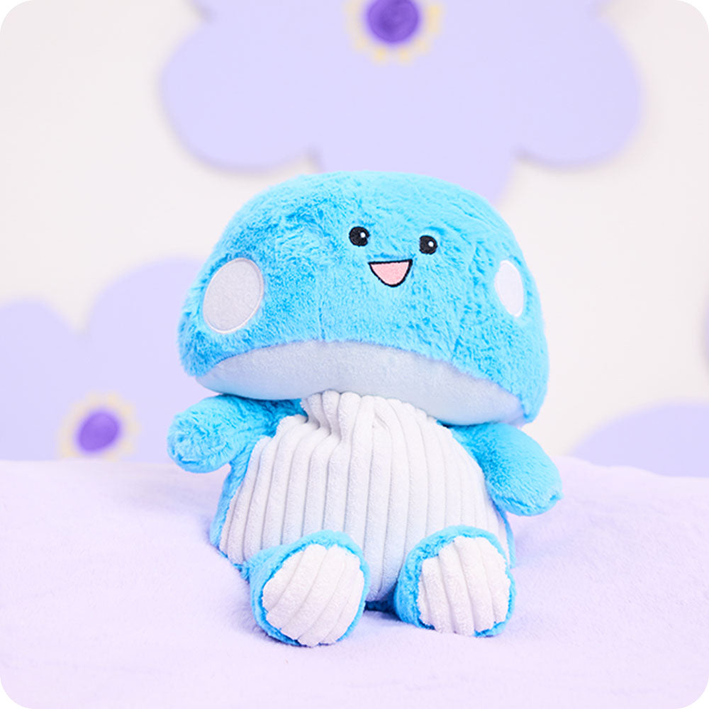 Image 106: blue mushroom stuffed animal warmies on purple background