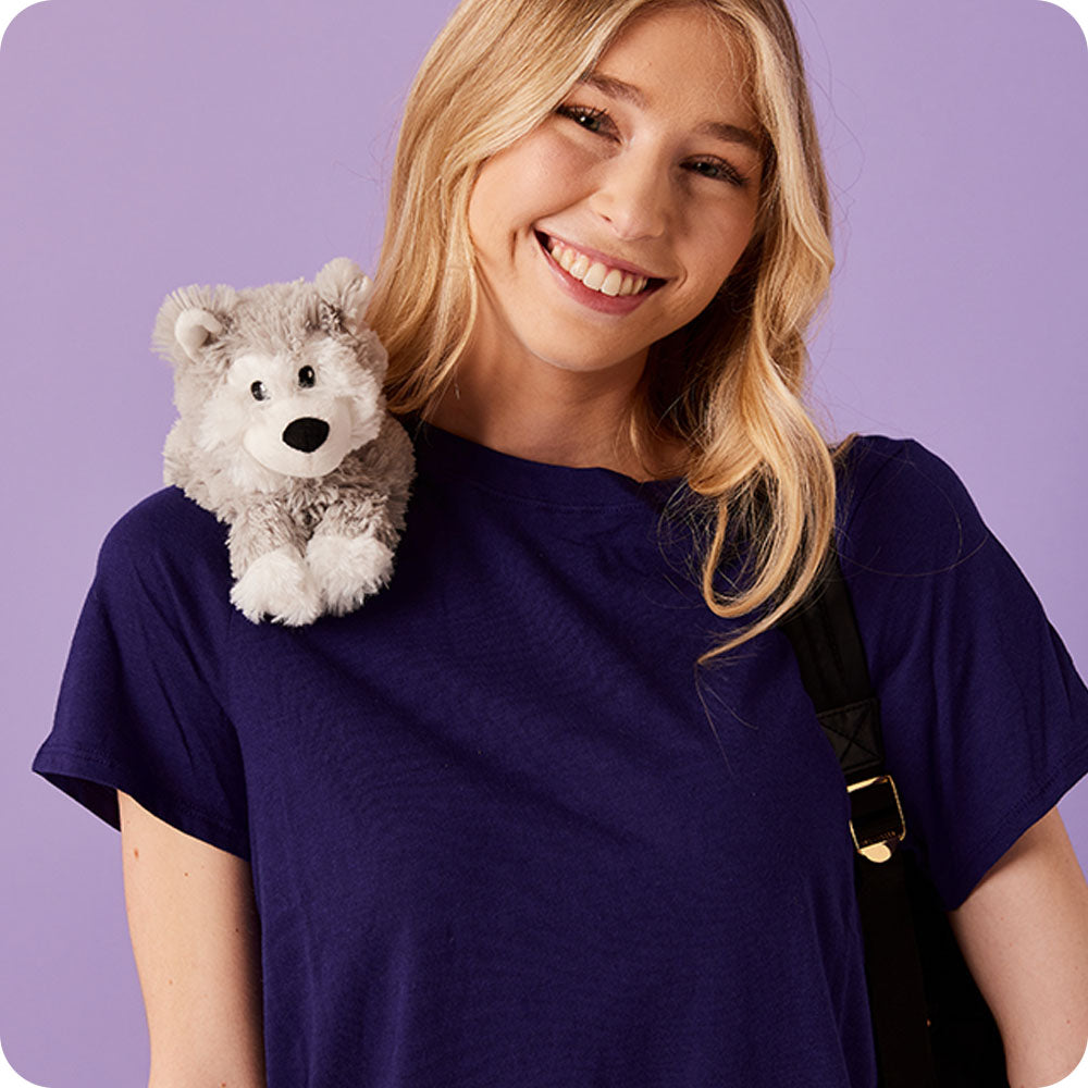 Image 98: girl with husky stuffed animal on her shoulder