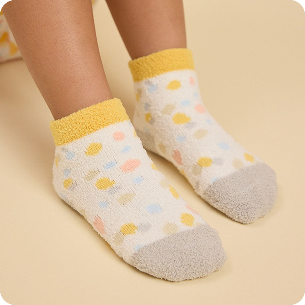 Image 112: colorful calico cat socks on kids feet