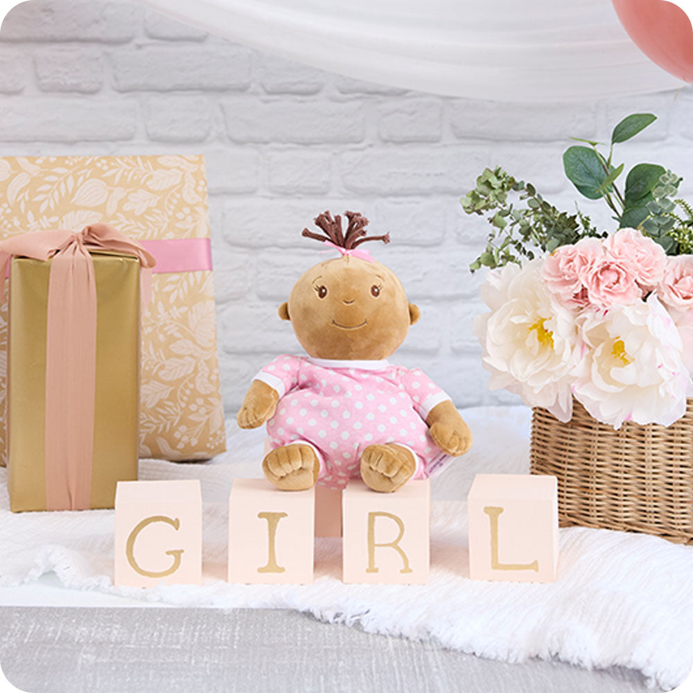 Image 99: baby girl stuffed animal at a baby shower