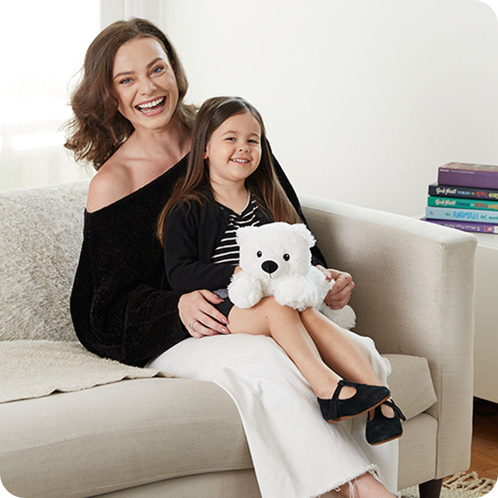Image 103: white bear warmies on lap lifestyle