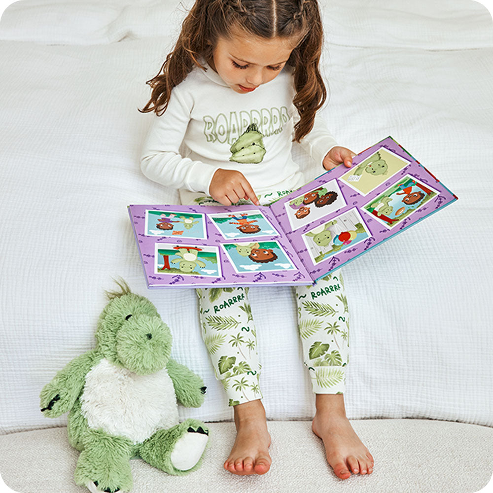 Image 97: girl reading Dinosaur Discovers Confidence warmies book