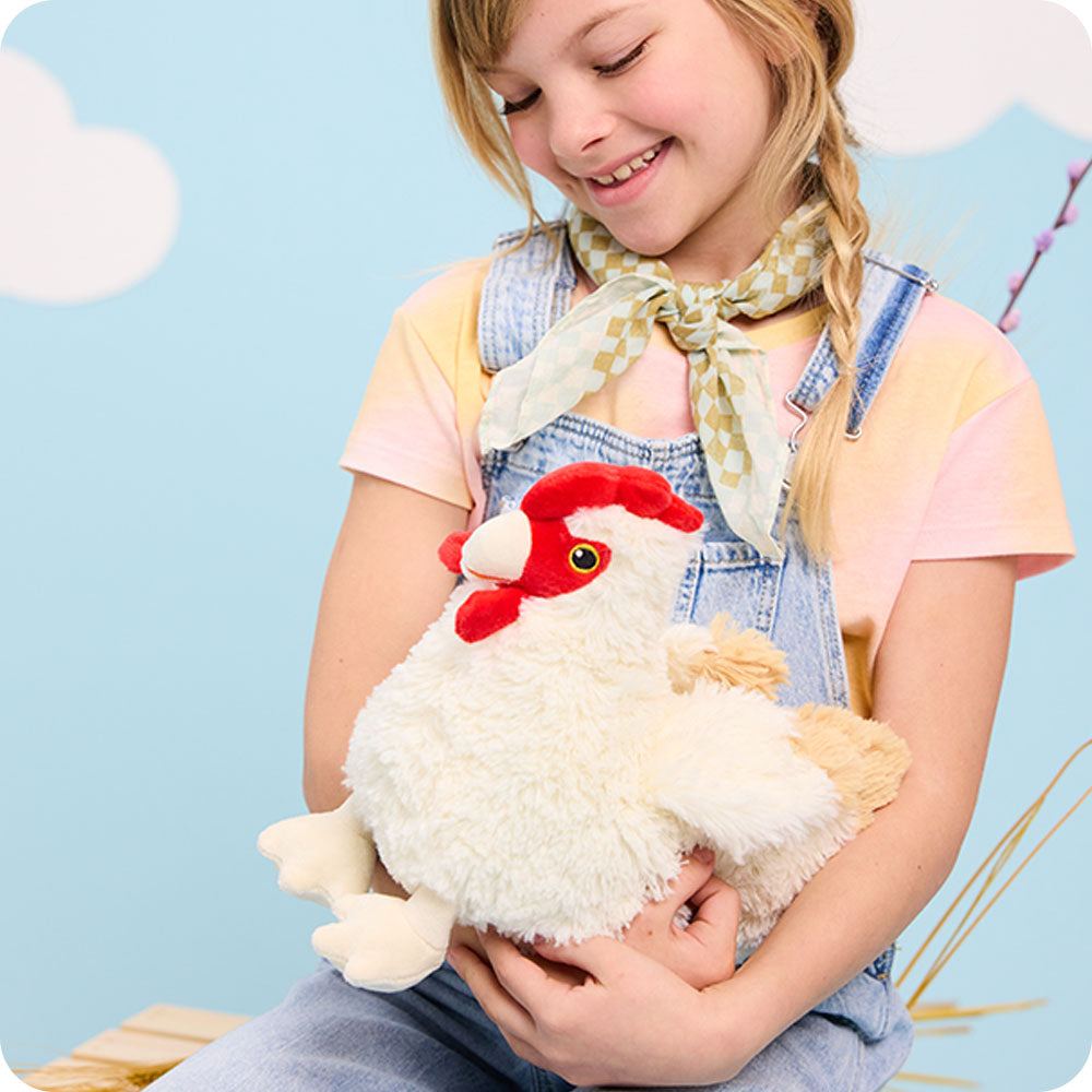 Image 103: girl holding chicken stuffed animal warmies