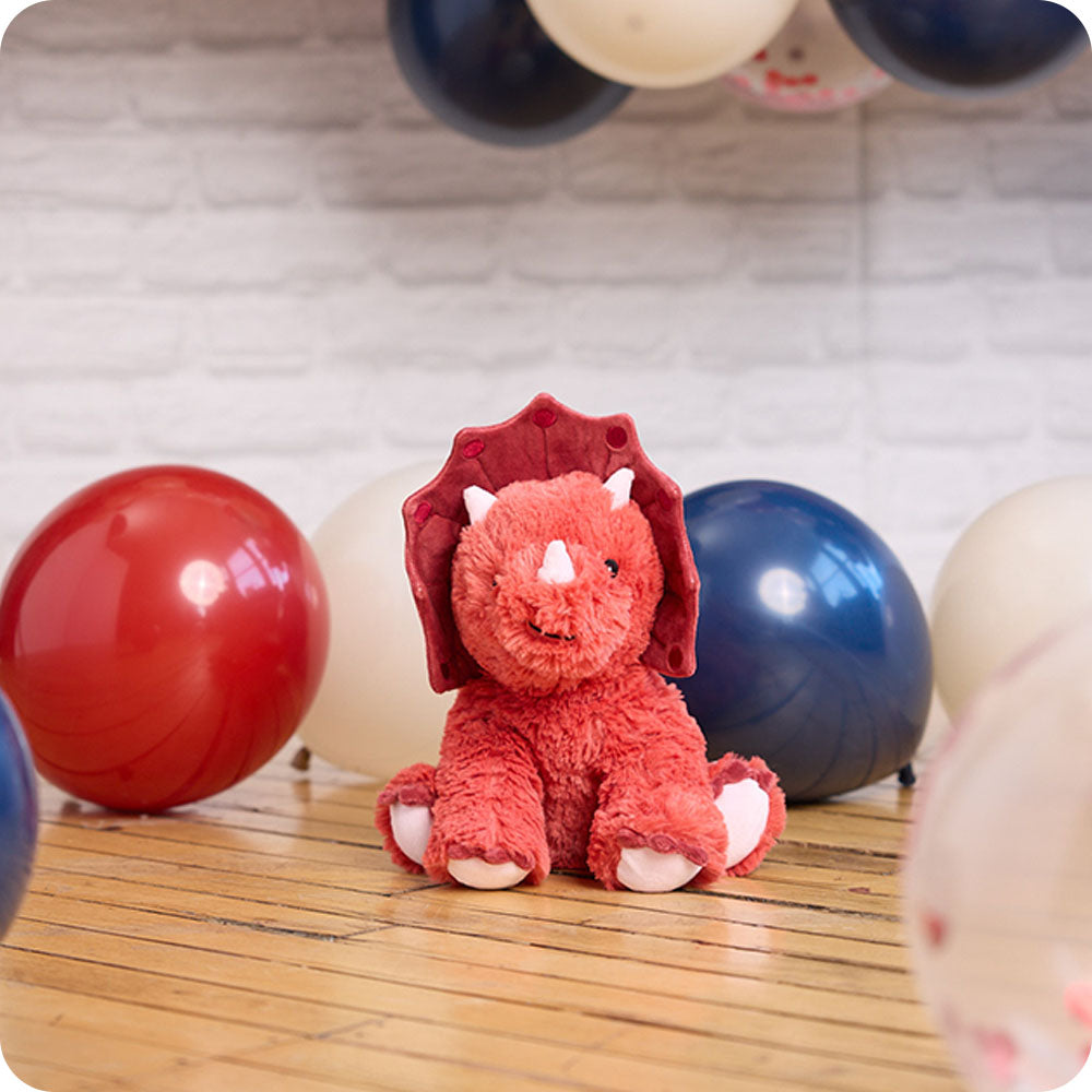 Image 104: red triceratops stuffed animal with balloons