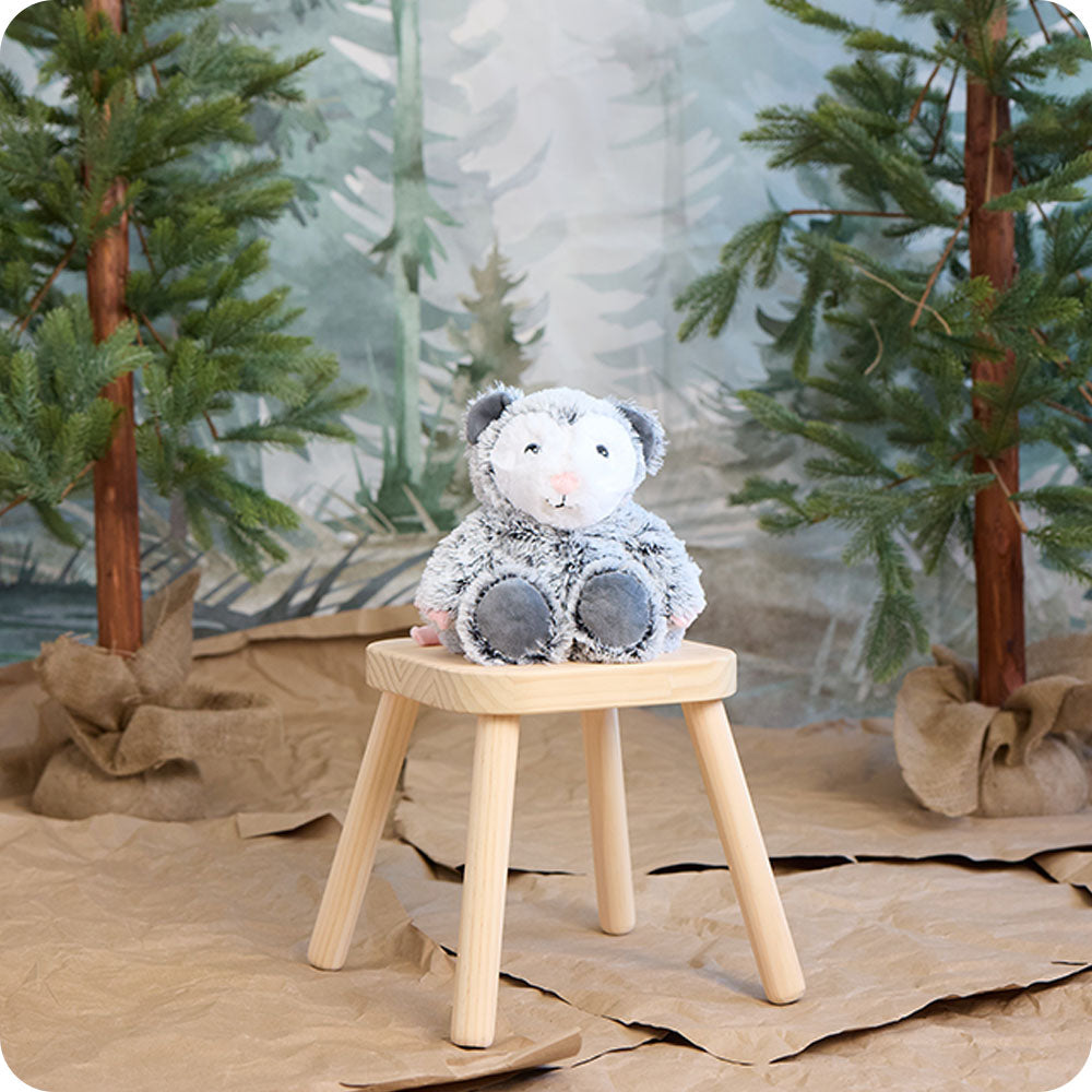 Image 104: opossum stuffed animal warmies in a woodland setting