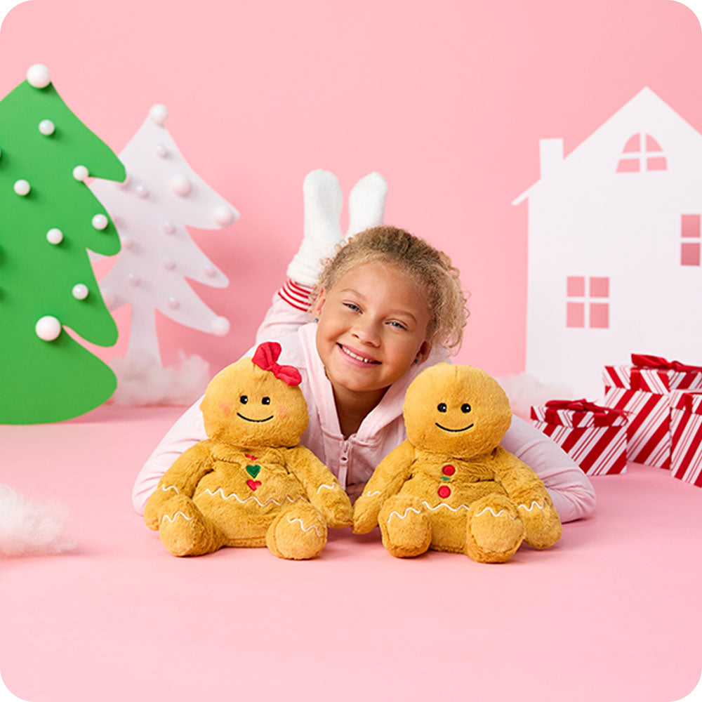 Image 99: girl cuddling gingerbread girl and boy stuffed animal warmies