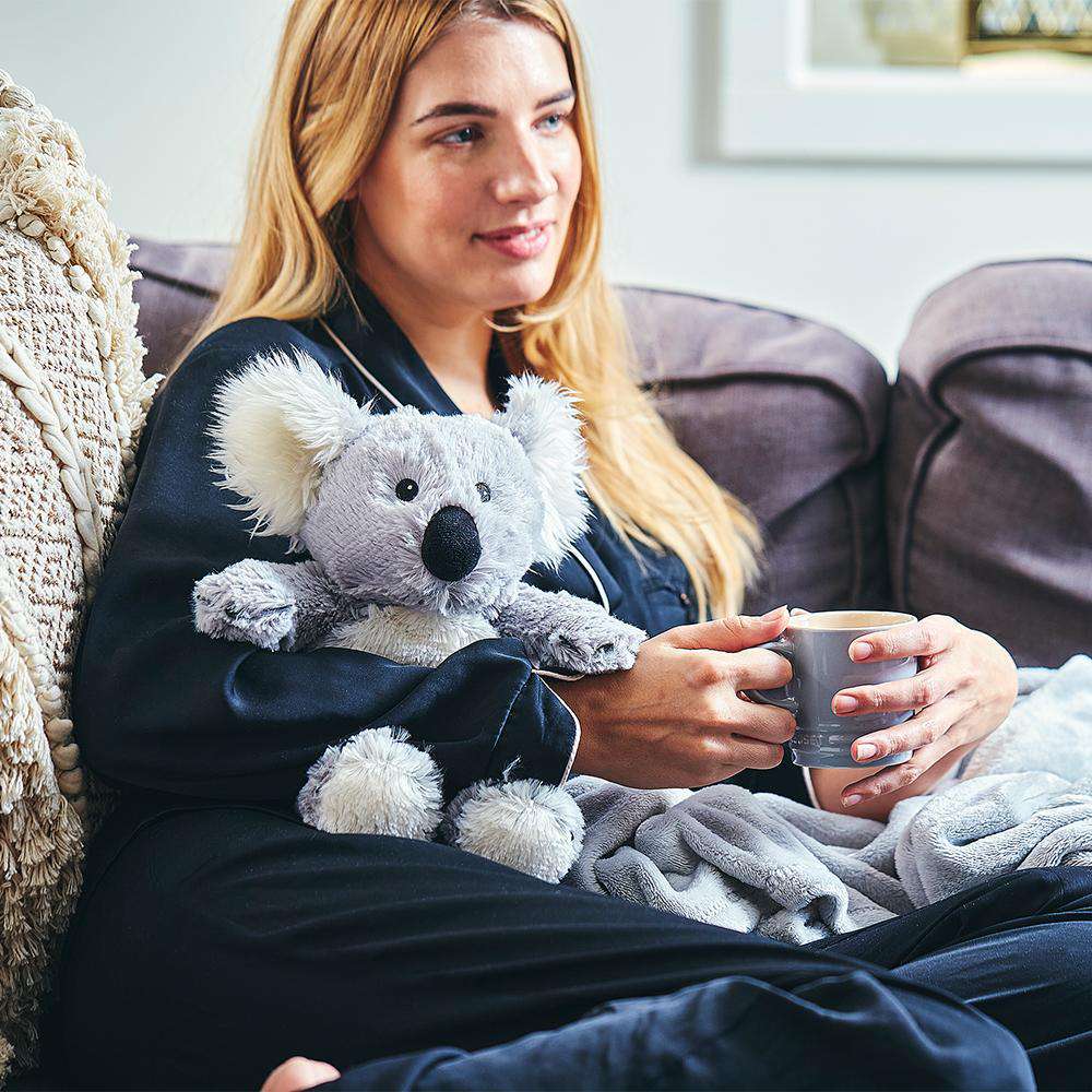 Image 99: Woman hugging Cute Weighted Lavender Scented Koala Stuffed Animal Heating Pad Warmies