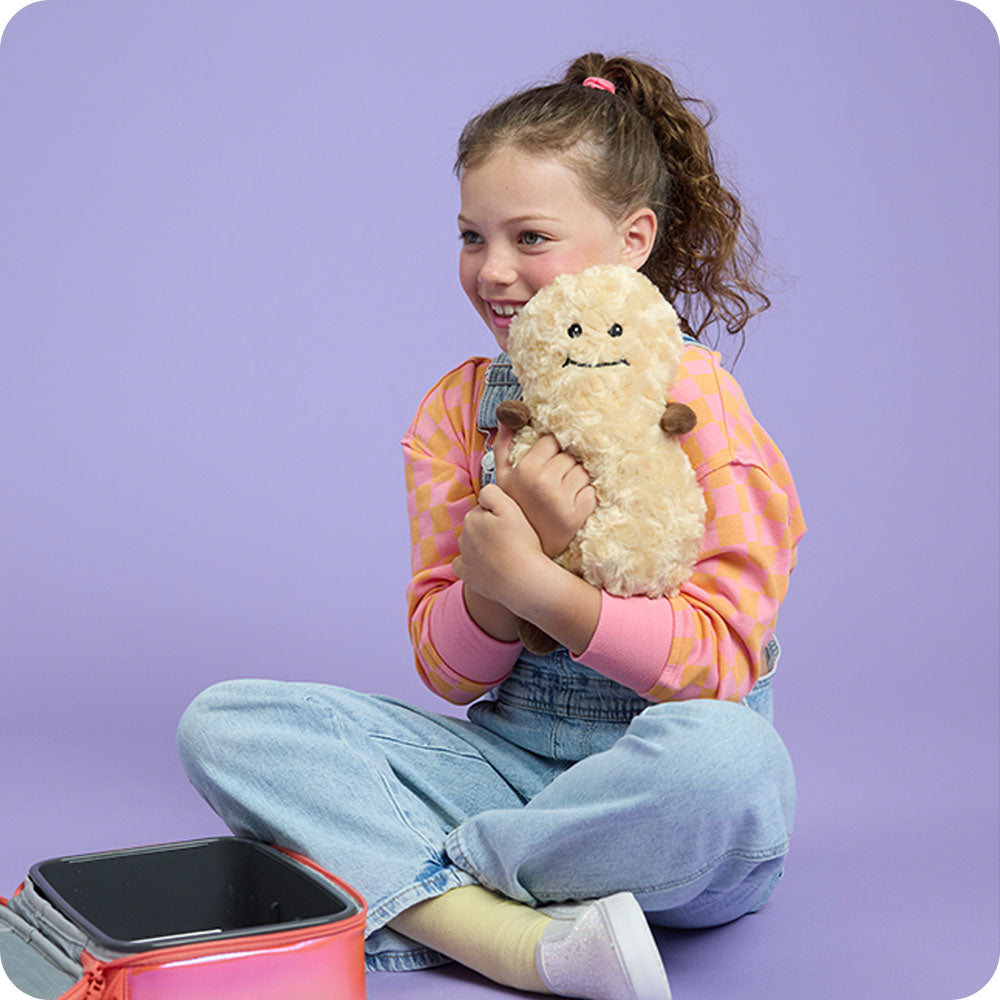 Image 103: girl hugging peanut stuffed animal warmies